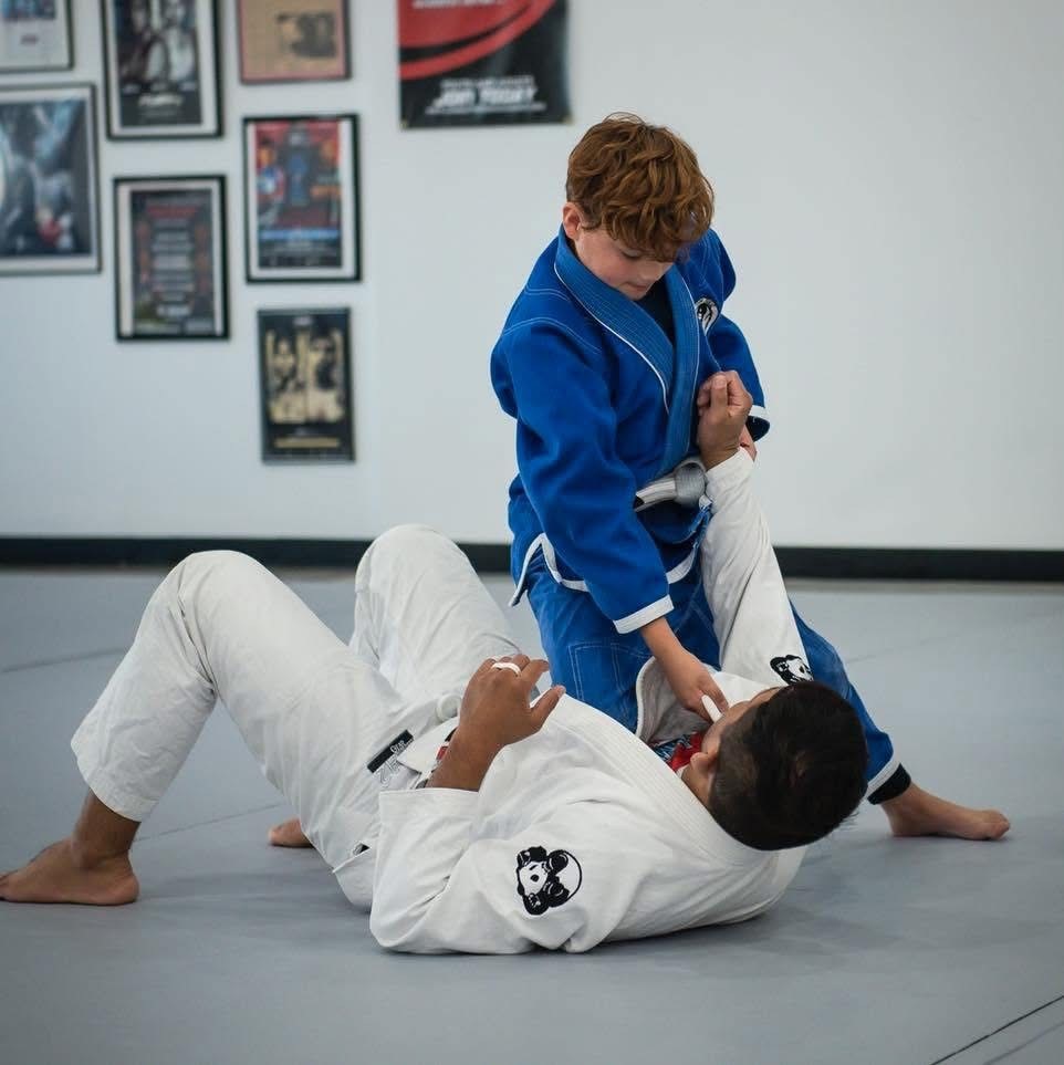 Youth martial arts class practicing together
